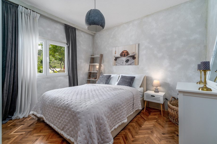 Bedroom NO1 (14sqm) with a queen-size bed 160cm x 200cm, a TV, and pool views