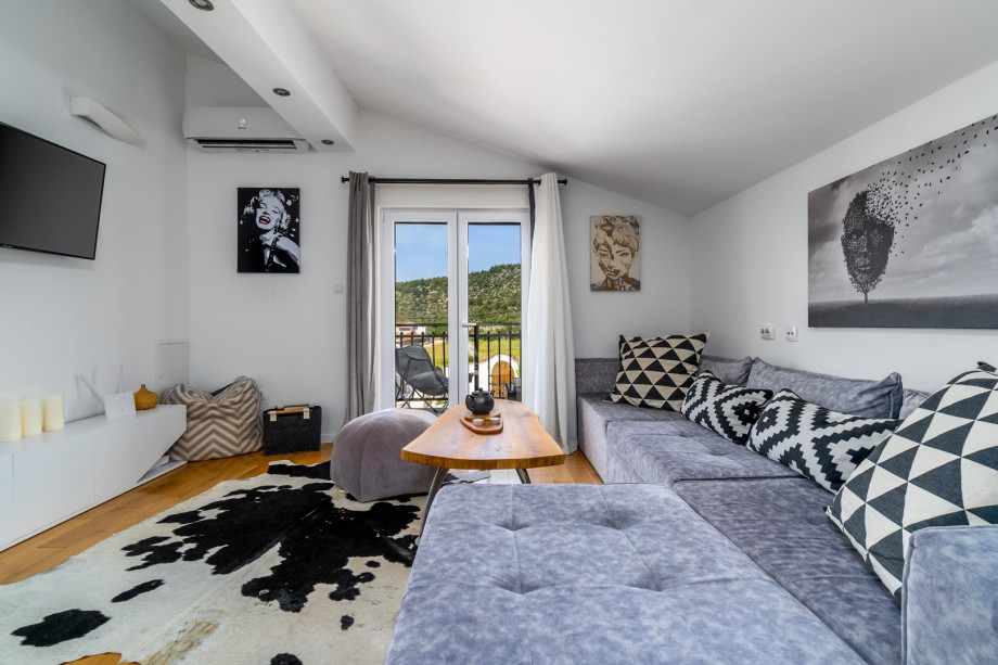 The outdoor staircase takes you to the first floor with a fully equipped kitchen and living room