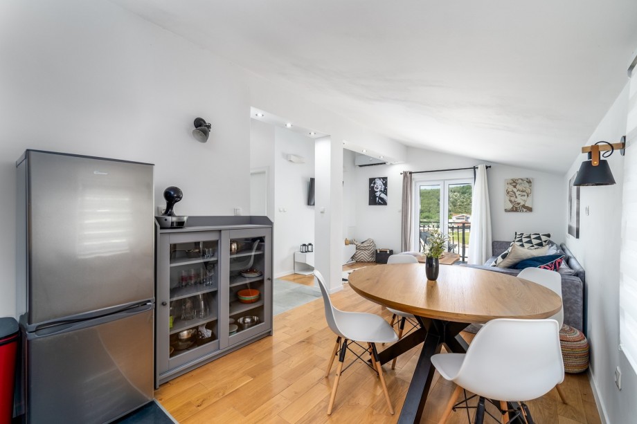 There is also a Dolce Gusto coffee maker and a dining table for 4