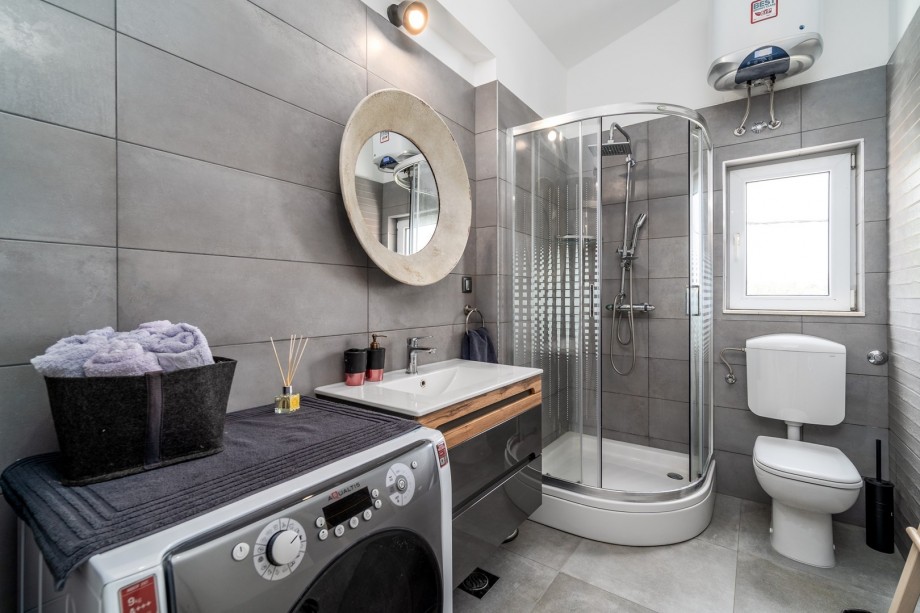 There is also a family bathroom with a shower and a washing machine.