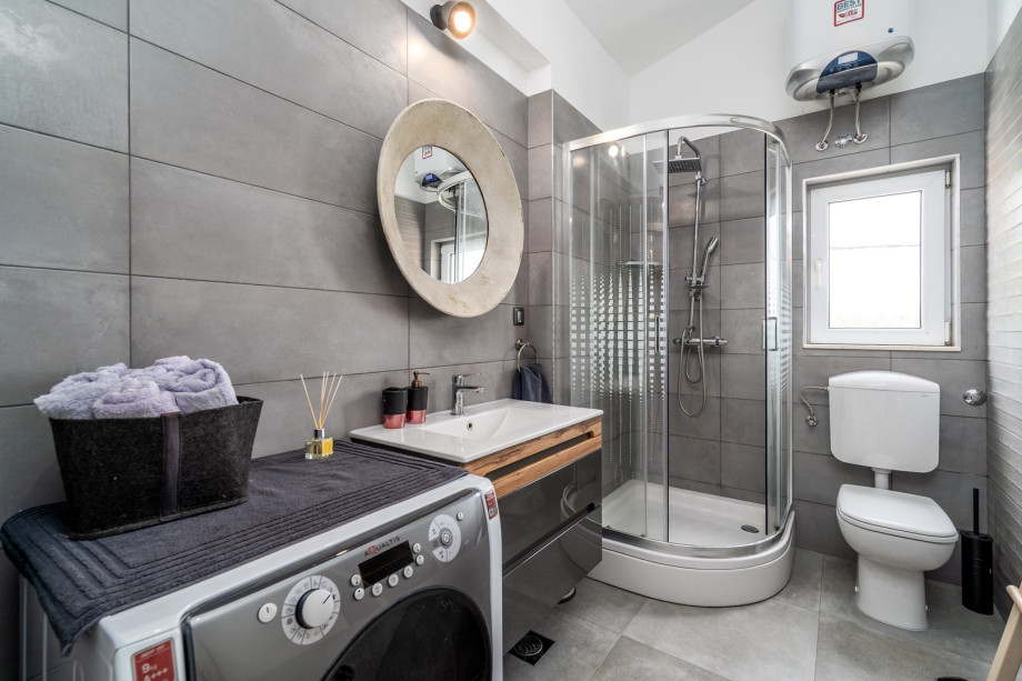 There is also a family bathroom with a shower and a washing machine.