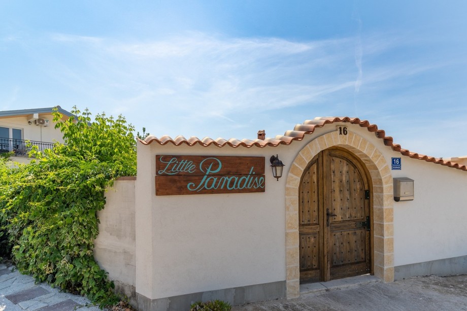There is a parking lot secured for 3 cars in front of the property on the private lot