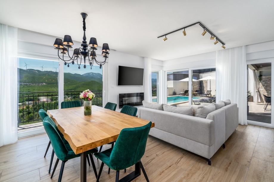 The ground floor (pool level) offers a spacious and very nicely decorated living area