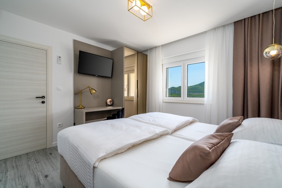 A Bedroom No3 with views on the terrace with jacuzzi, TV, A/C, and an en-suite bathroom