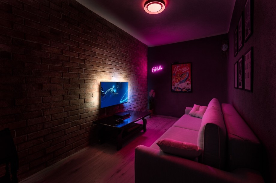 The lower ground floor (Jacuzzi level) offers a Media room with a TV, PS4, free WiFi, a comfortable sofa that can convert into a sofa bed for 2