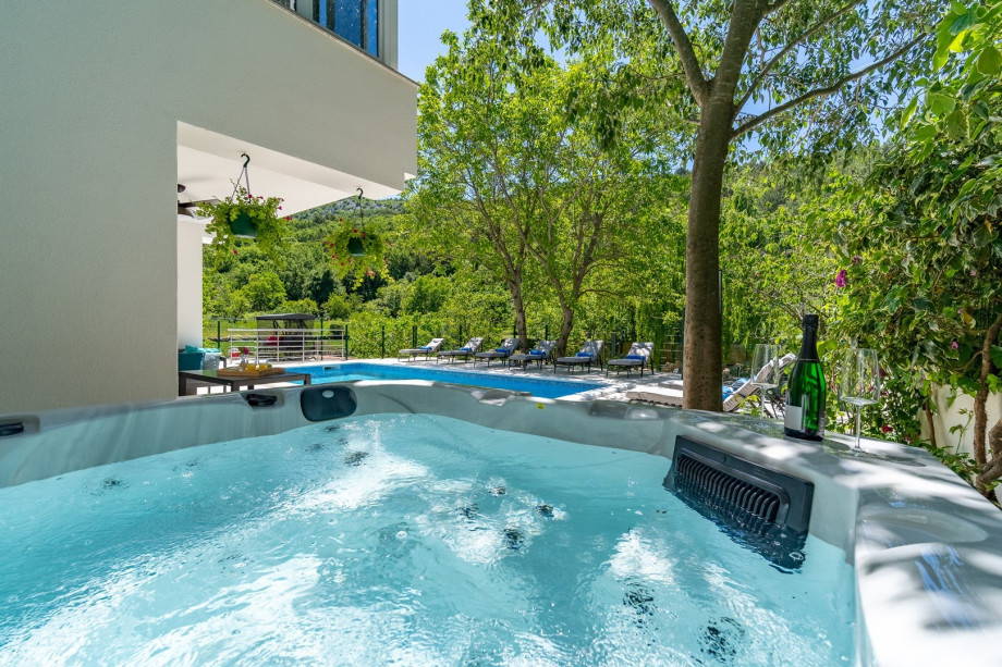 The outdoors offers a Hot tub, sun deck area with 8 sun deck loungers