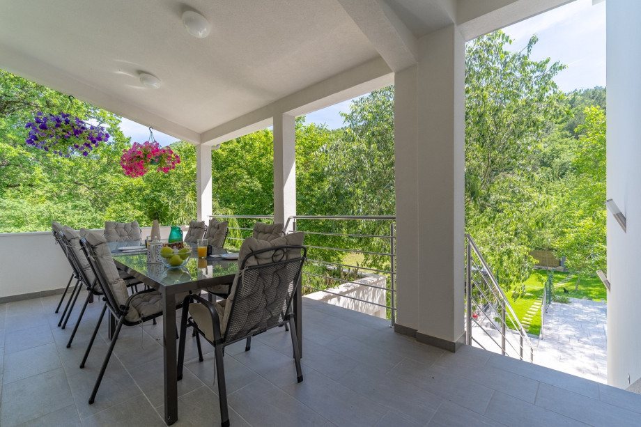 There is an outdoor dining area only few steps up next to the main entrance to the house