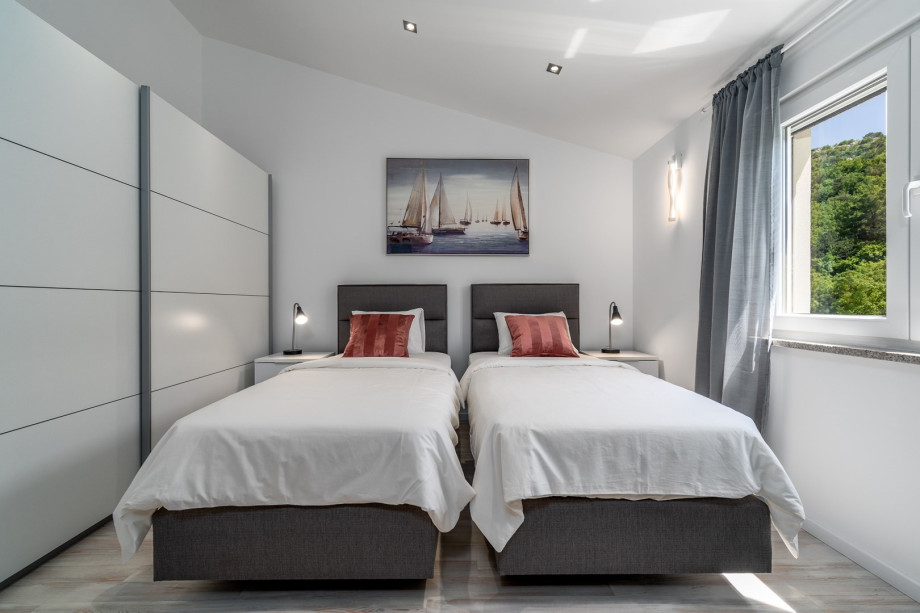 Bedroom No2 with two single beds 90cm x 200cm that can connect into a king size bed
