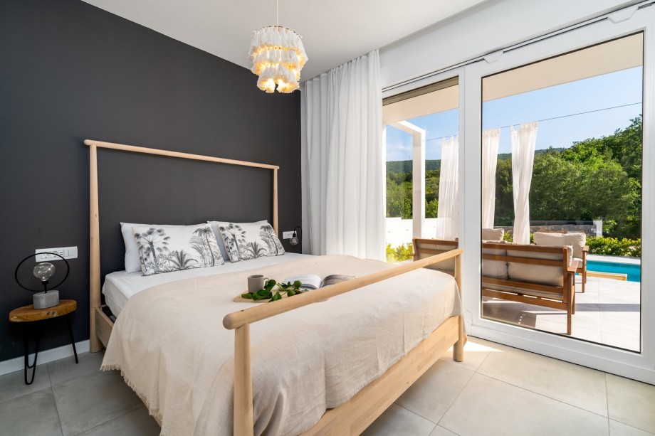 A Bedroom No1 with double bed 160cm x 200cm with pool view and exit the terrace