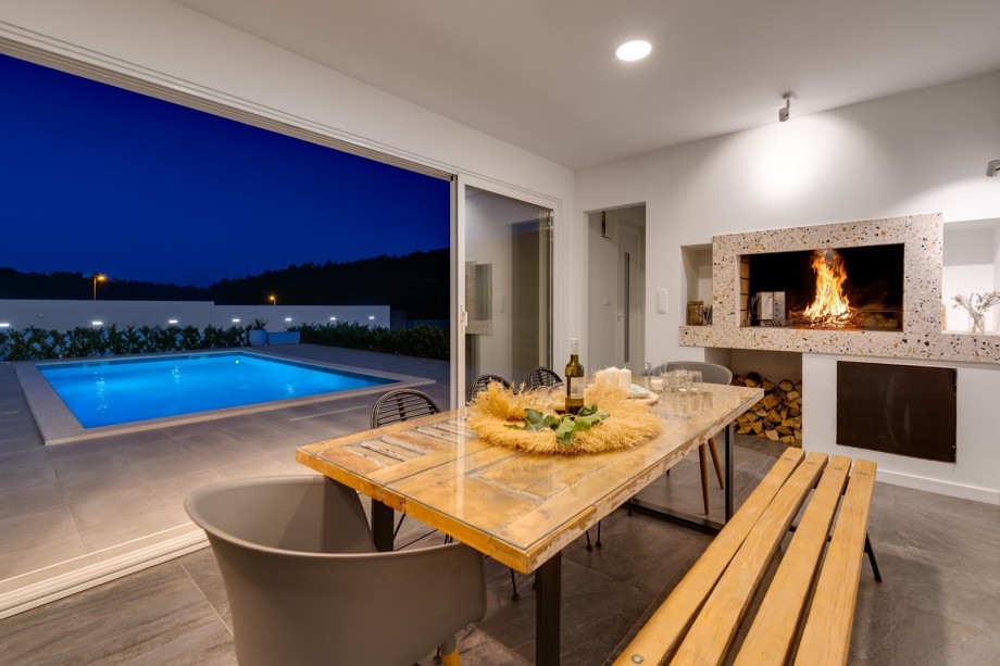 Enjoy the summer kitchen next to the pool