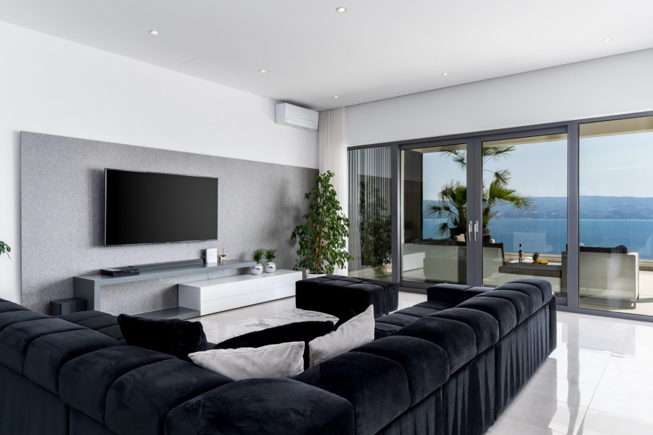 Very modern and comfortable living area with open sea and pool views