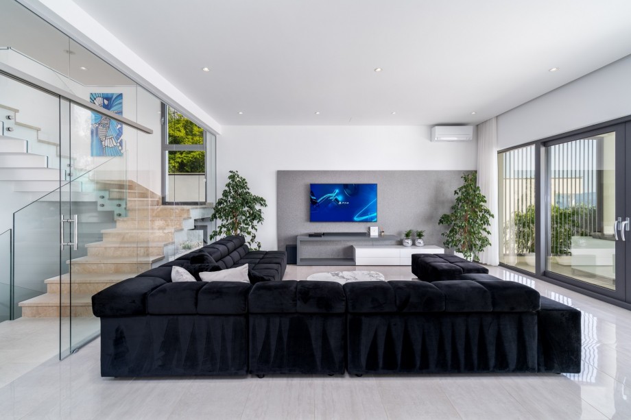 Very modern and comfortable living area with open sea and pool views