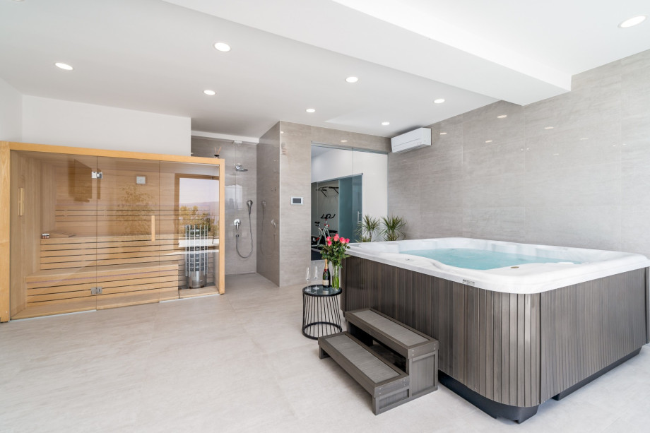 Spa area with gym, Finish sauna, whirlpool, and shower