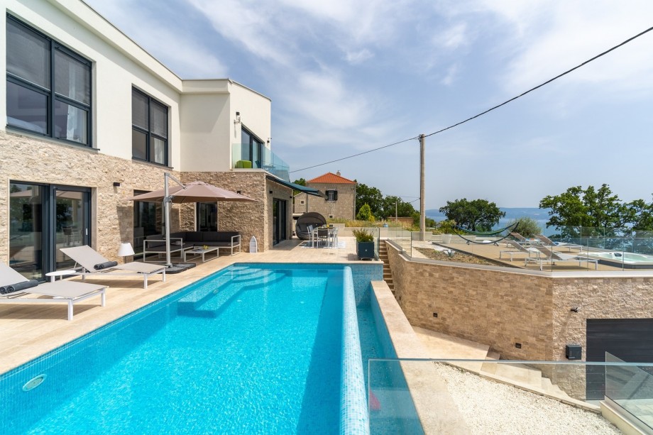 Located at the top of the KRUG street overviewing the village and the coast, surrounded by typical Mediterranean vegetation offering a quiet and peaceful stay for you and your family.