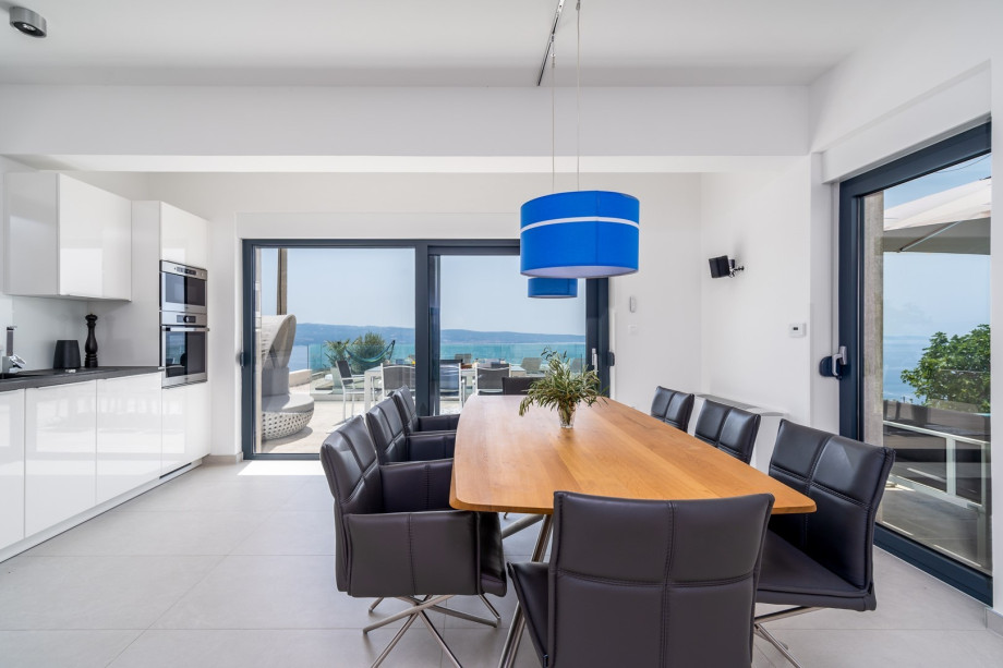 The ground-floor offers a fully air-conditioned and stylish living and dining room