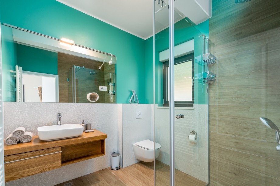 There is also a separate family bathroom with a shower, toilet, and washing machine.