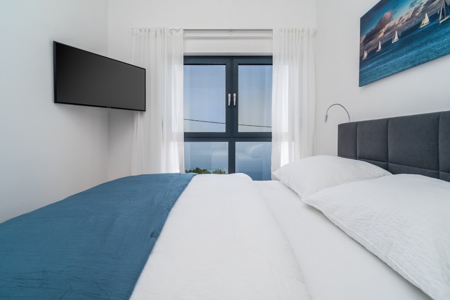 Air-conditioning, a TV and open sea and island views