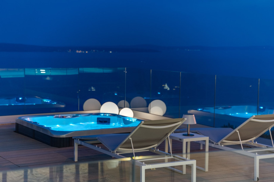 There is outdoor table tennis in the garage, a portable basketball hoop, and a secured parking lot for 2 cars.