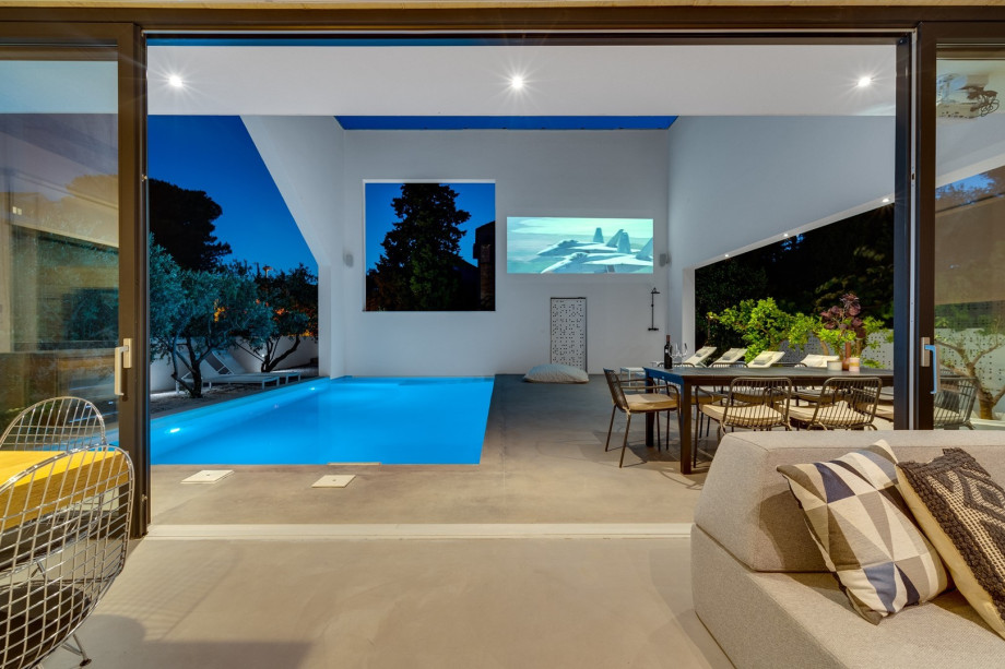 A Projector with surround-sound system (your private cinema area)