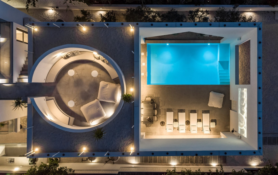 The luxury and contemporary architectural design of Villa Altabianca, with opened white walls surrounding the pool area giving a special architectural feature to this amazing property spreads