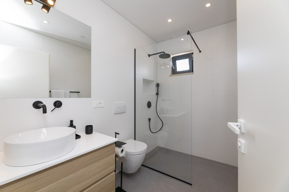 En-suite bathroom with a shower.