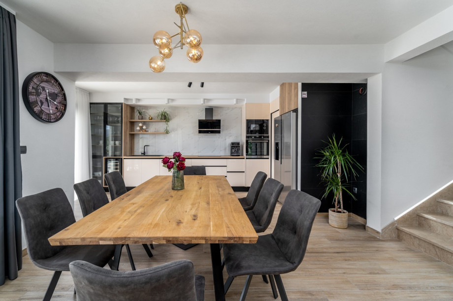 There is a separate toilet with a washing machine