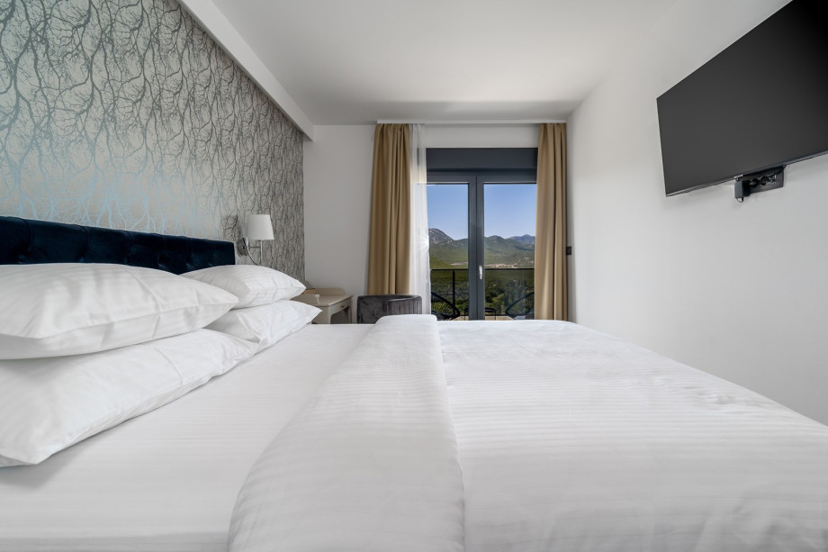 Bedroom NO1 (13sqm) with queen bed 160cmx200cm, a sofa bed for 1 person, en-suite bathroom, a TV, A/C and a balcony