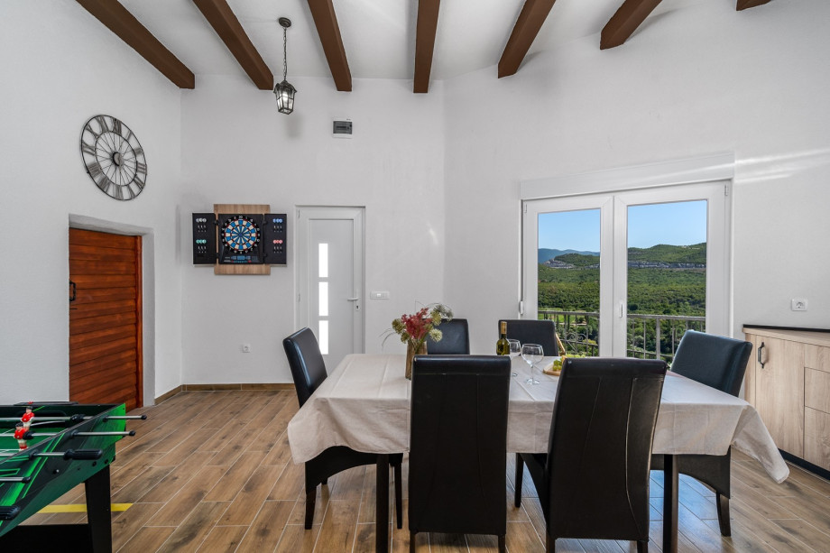 It also offers a dart board and a combination of mini soccer/ mini billiards/ mini table tennis