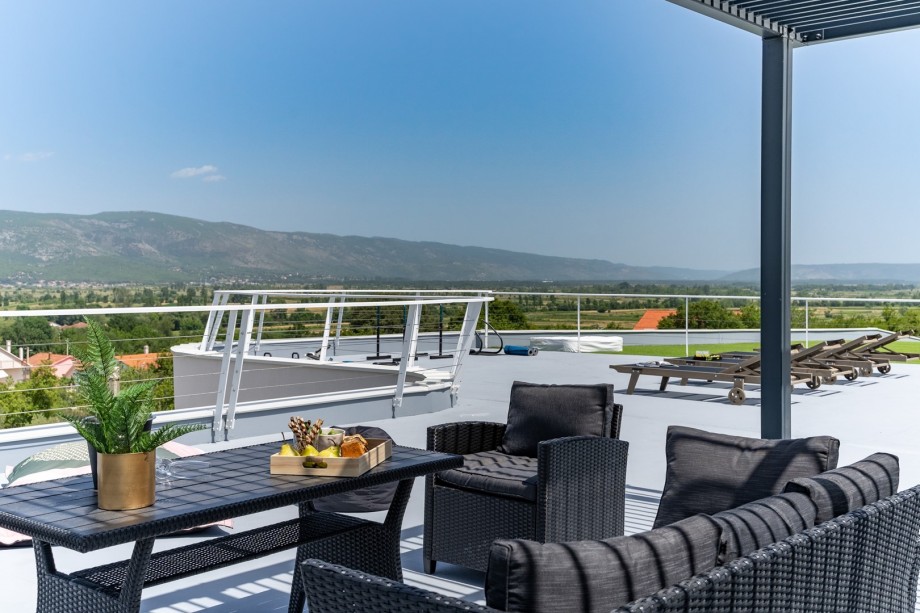 The Rooftop outdoors (230sqm) is approached by an outdoor staircase, and it is fully fenced