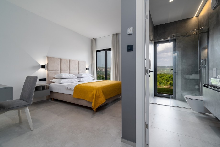 Bedroom No1 with a king size bed 180cm x 210cm, a TV, en-suite bathroom , and a make-up table