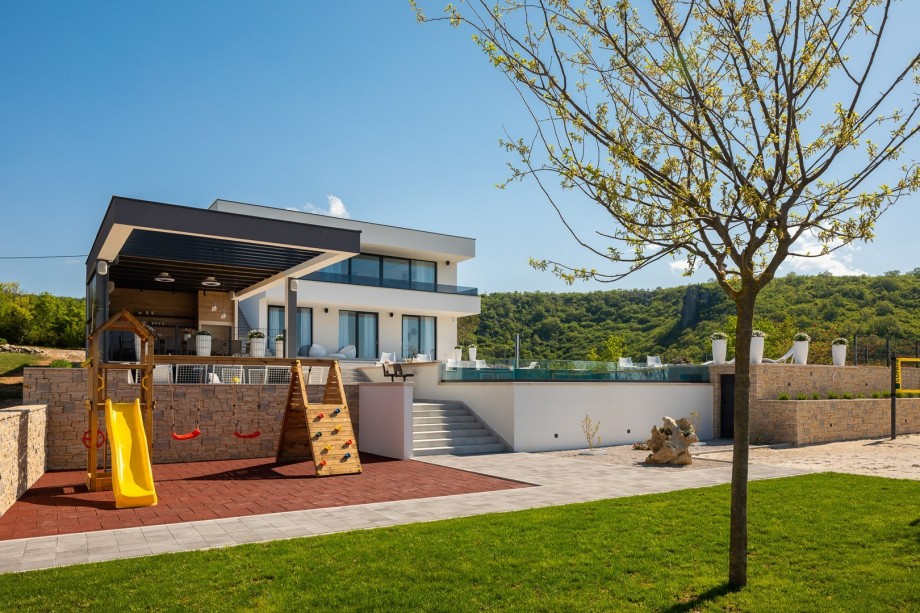 The children's playground with a wooden house