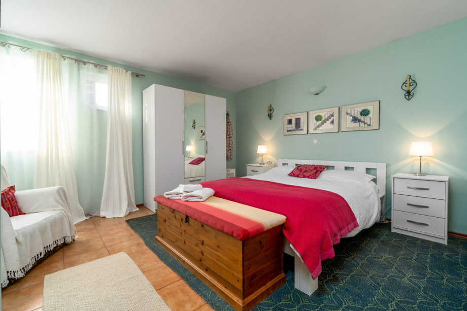 A bedroom No1 located on the ground floor with a king-size bed (180cm x 200cm)