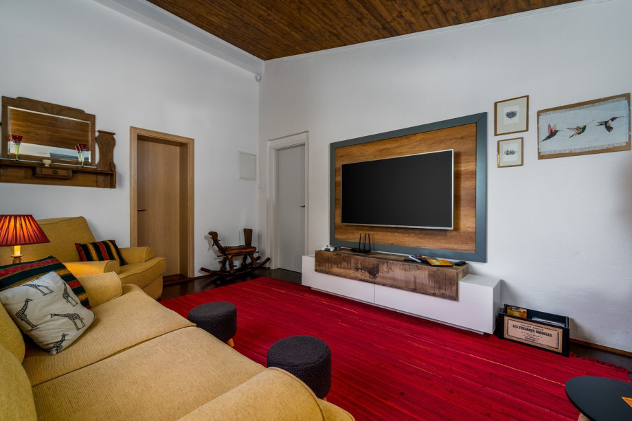 A second living room (first floor) with cozy sofas, flat-screen TV, Xbox and couple games