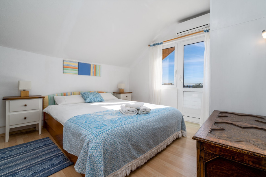 A bedroom No2 located on the first floor with a queen-size bed (160cm x 200cm)