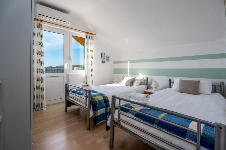 A bedroom No3 located on the first floor with two single beds (90cm x 200cm)