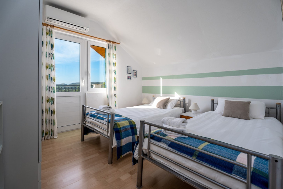 A bedroom No3 located on the first floor with two single beds (90cm x 200cm)