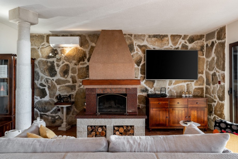 On the ground floor there is a kitchen and a living room with a sofa