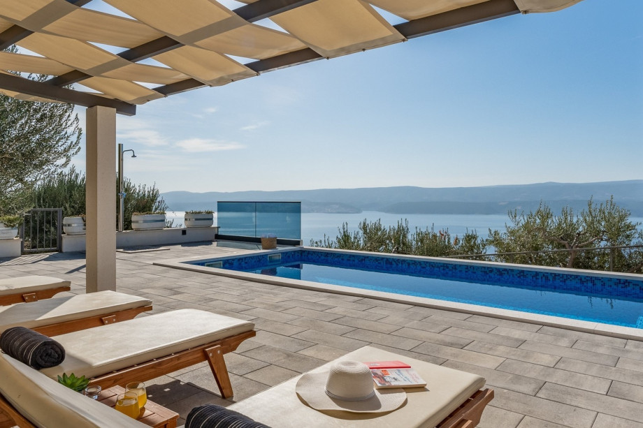 Private 27sqm pool and comfortable lounge chairs, open sea view