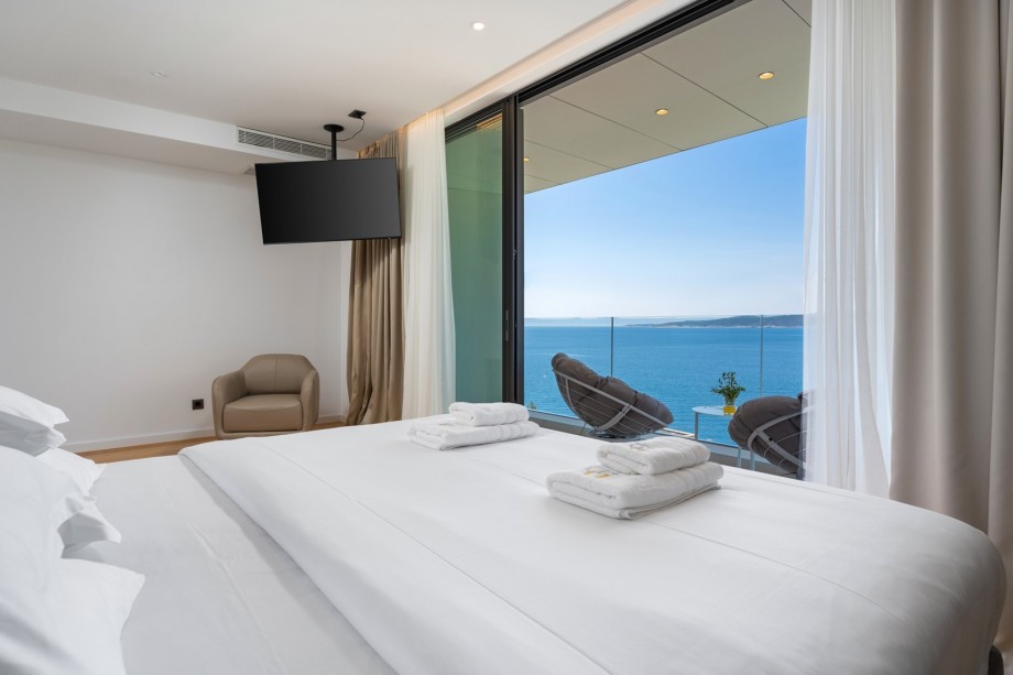 Bedroom No2 offers amazing sea views and a terrace with outdoor furniture