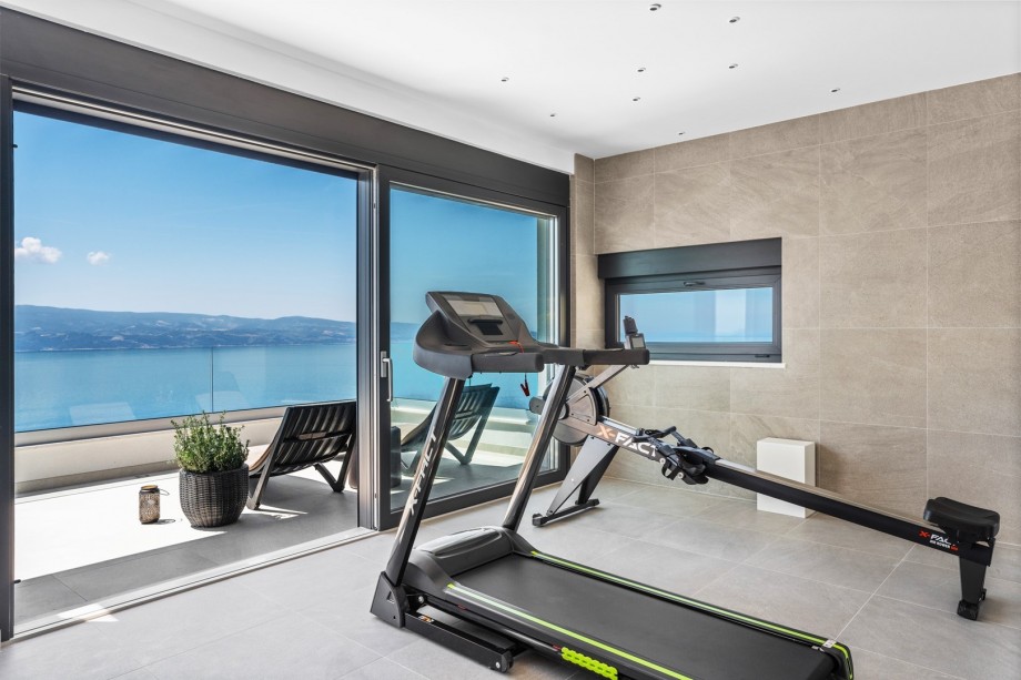 Gym with an A/C, and exit to the terrace.