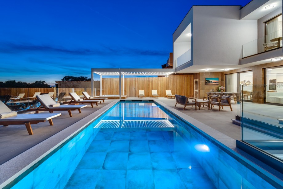 Carefully placed lighting completes the perfect experience for summer evenings