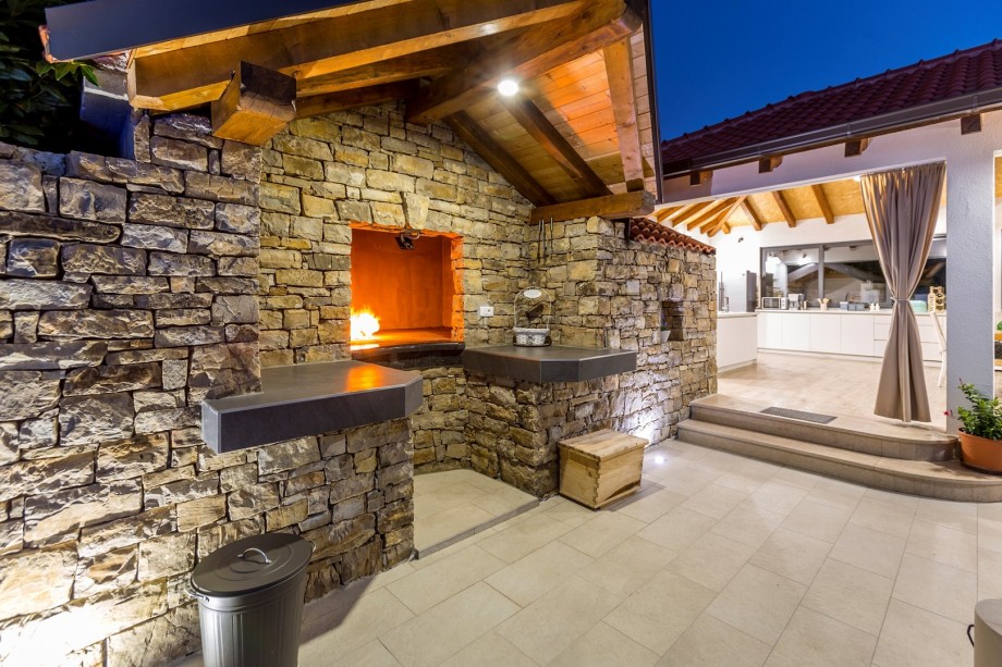 Traditional barbecue next to the summer kitchen