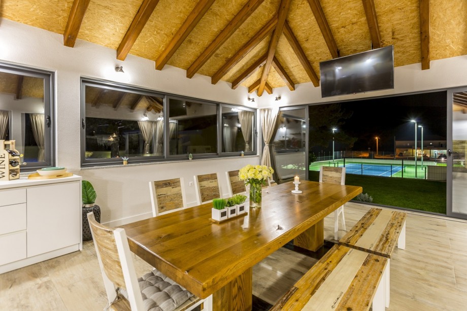 Dining area with a fully equipped kitchen with exit to the pool area,