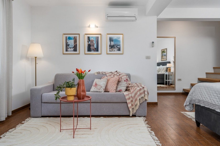 The bedroom area  offers a king-size bed 180cm x 200cm, a sofa that can convert into a sofa bed 160cmx200cm