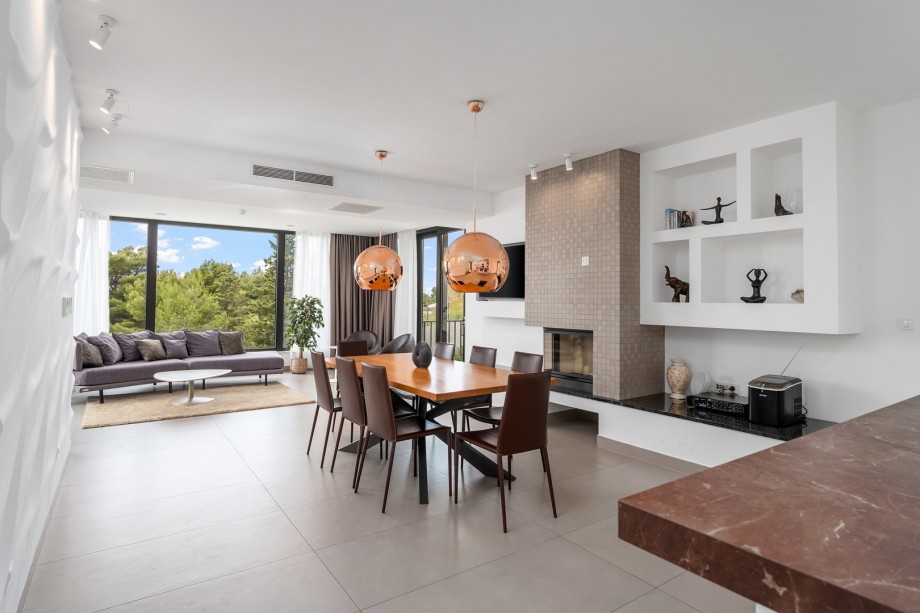 Fully equipped kitchen with exit to outdoor dining area and playground