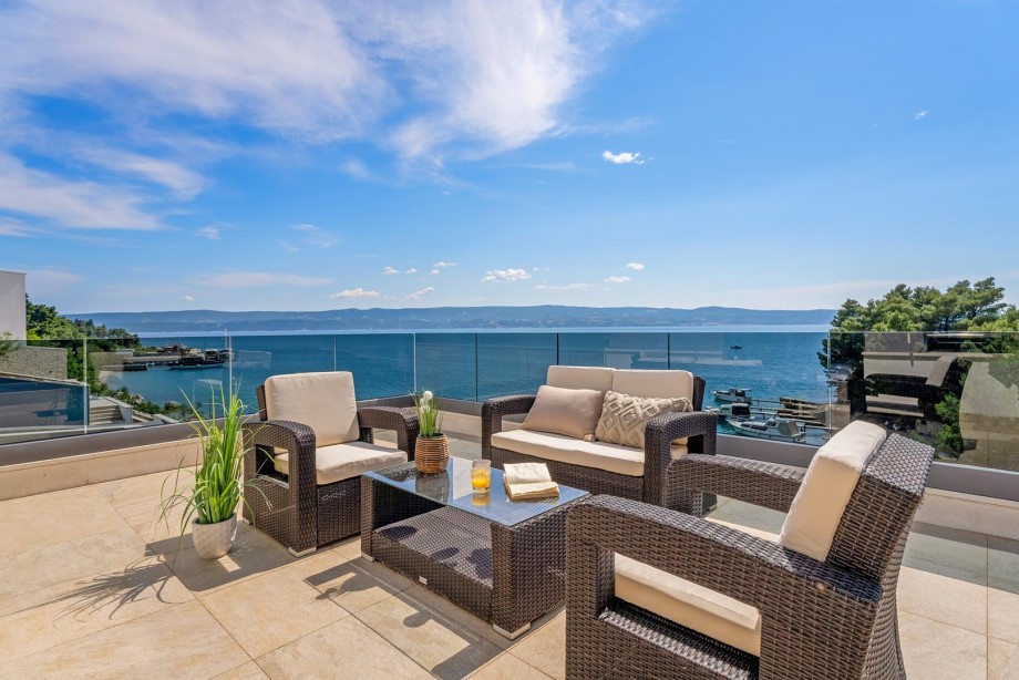 Terrace in front of two bedrooms with comfortable furniture