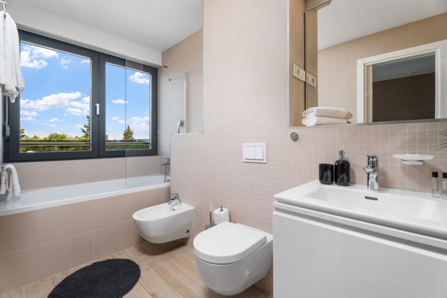 One of 4 en-suite bathrooms with bathtub, shower, bidet and sea views