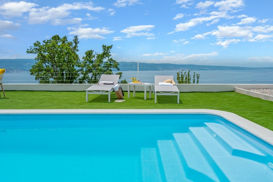 A private swimming pool 9m x 3,7m, a sun deck area with artificial grass, and with 4 deck chairs
