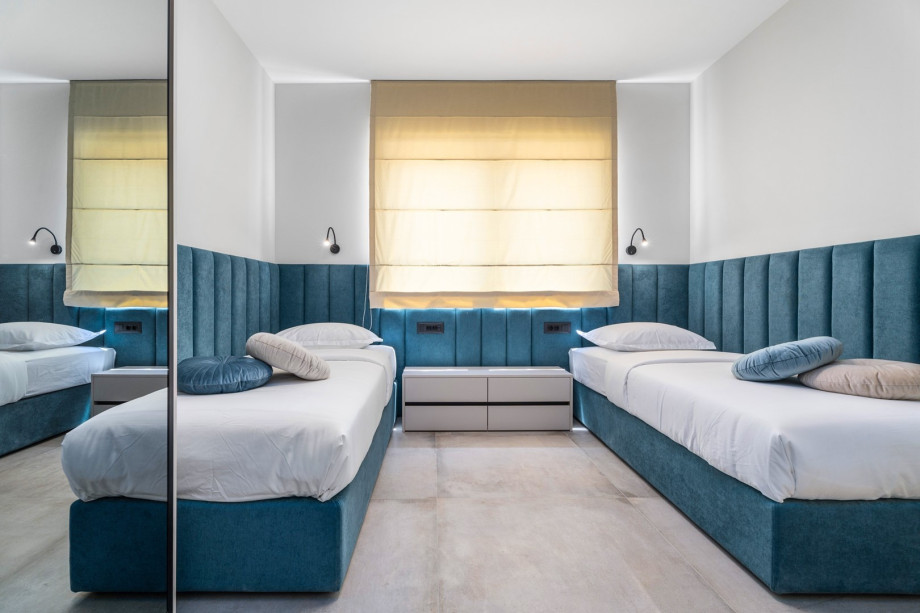 A Bedroom NO4 with two single beds 90cmx 200cm, a TV, A/C, en-suite Bathroom with a shower