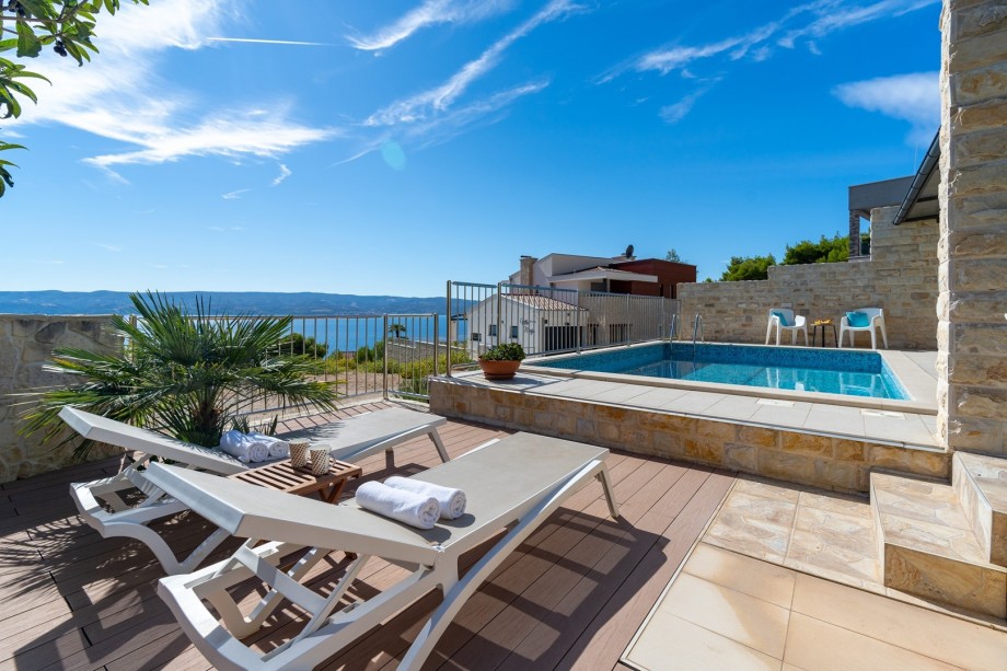 Private heated pool with 8 lounge chairs, sea view